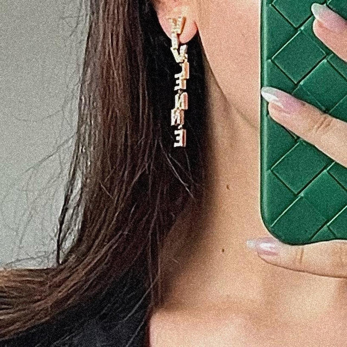 Vivienne Westwood large gold crystal spellout orb soho earrings