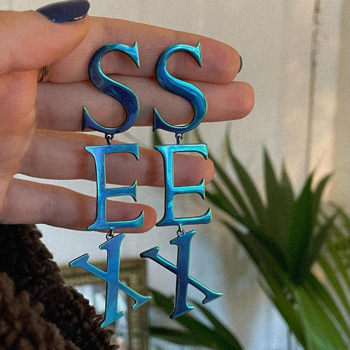 Vivienne Westwood sex blue oil spill earrings