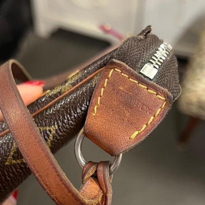 Louis Vuitton perforated pochette bag