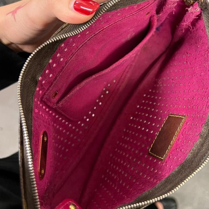 Louis Vuitton perforated pochette bag