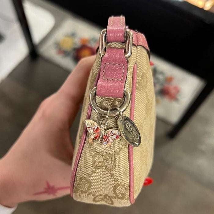 Gucci pink pochette with butterfly charm
