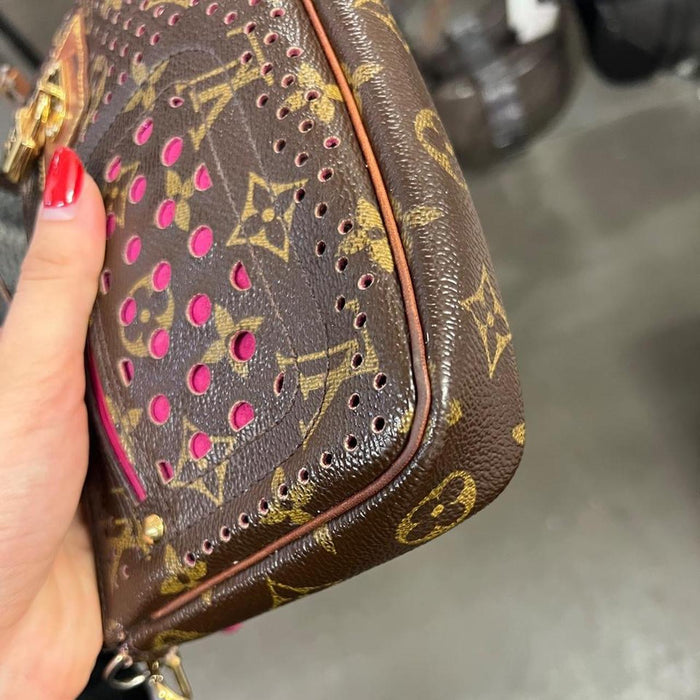 Louis Vuitton perforated pochette bag