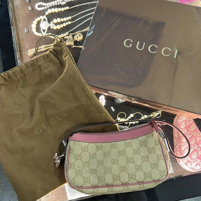 Gucci pink pochette with butterfly charm