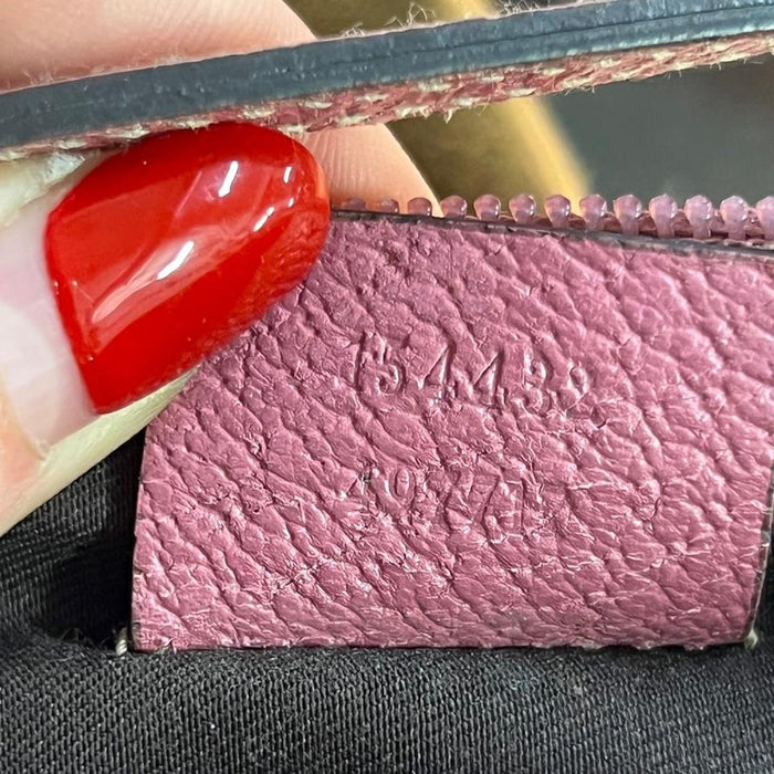 Gucci pink pochette with butterfly charm