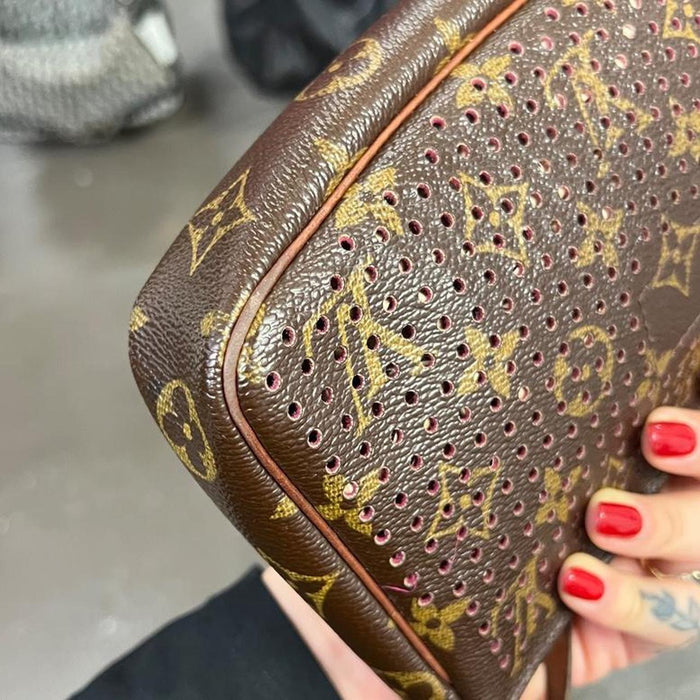 Louis Vuitton perforated pochette bag