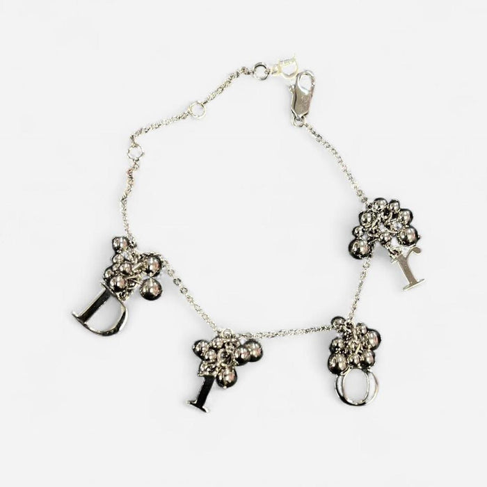 Christian Dior silver cluster spellout bracelet