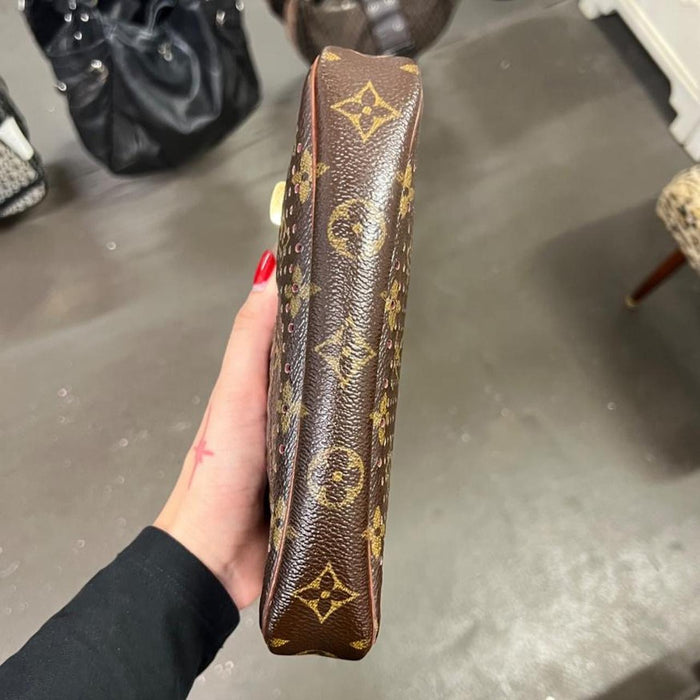 Louis Vuitton perforated pochette bag