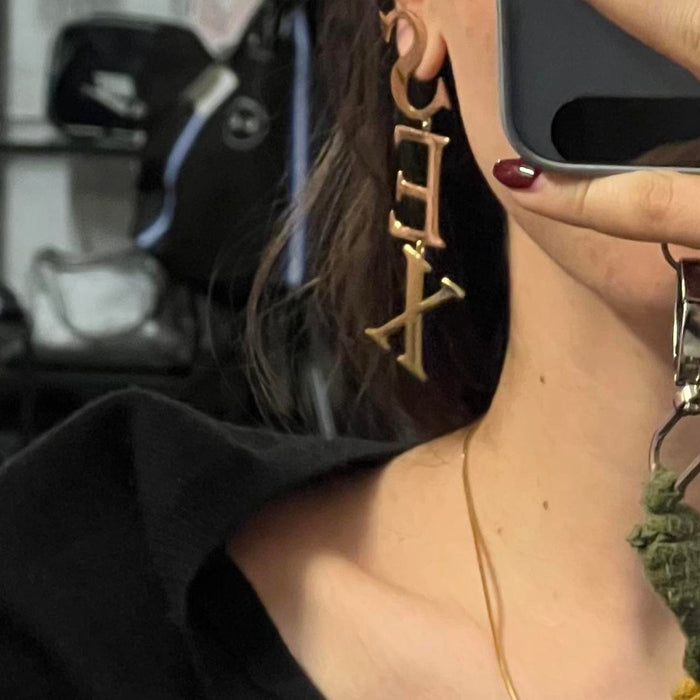 Vivienne Westwood gold sex earrings