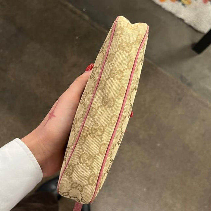 Gucci pink pochette with butterfly charm