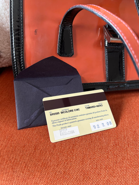 Prada orange and black shoulder bag