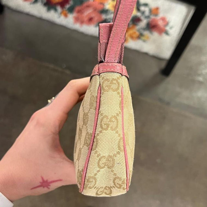 Gucci pink pochette with butterfly charm