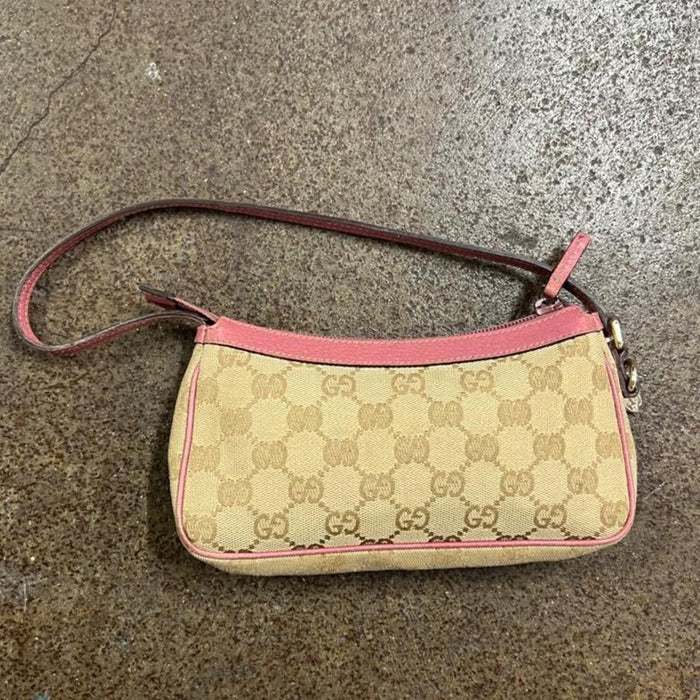 Gucci pink pochette with butterfly charm