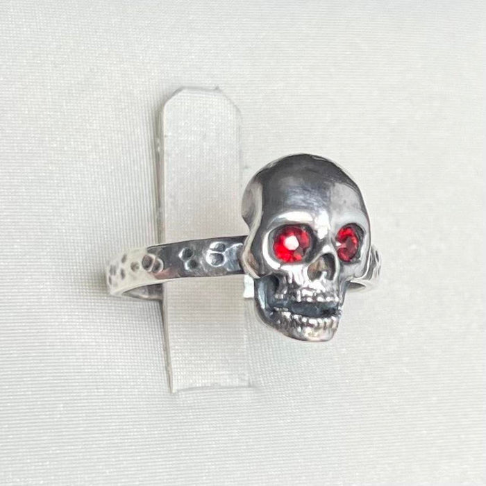 Solid silver skull ring with natural garnet eyes